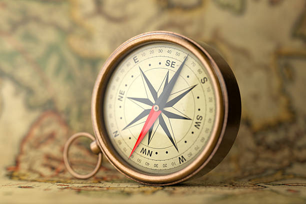 istock Antique Vintage Brass Compass on a Rare Map. 3d Rendering 626008912