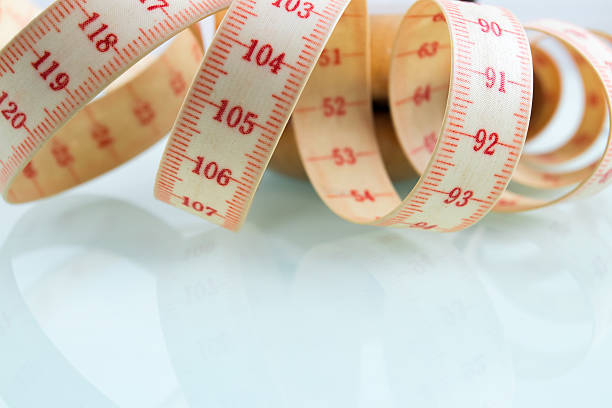istock Yo-yo effect concept. Wooden yoyo with centimeter measure. 626009124