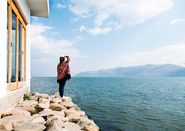 Woman enjoying the lake scenery.