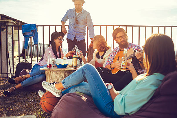 istock playful group of friends having fun on the balcony 626009158