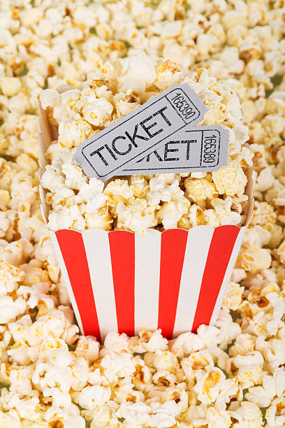 istock Box of popcorn with movie tickets 626009198