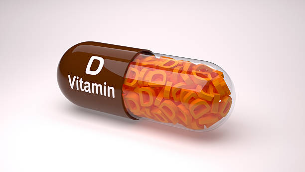 istock Brown pill or capsule filled with vitamin D. 626009516