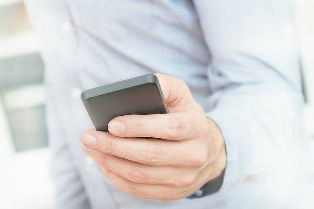 istock Urban guy / businessman with a cellphone. 626009966