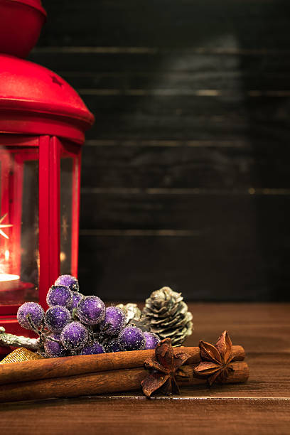 istock Christmas ornaments with lantern on brown natural wooden table. 626010128