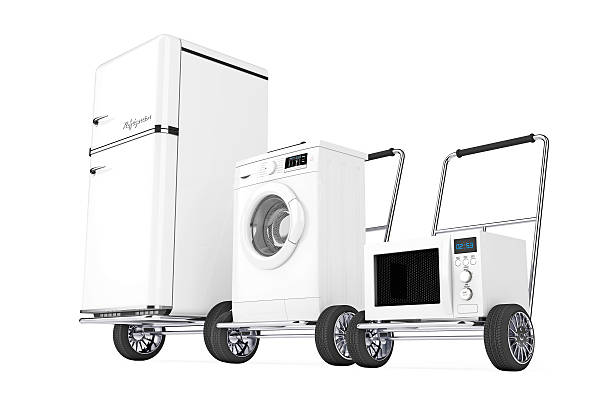 istock Fridge, Washing Machine and Microwave Oven over Hand Carts. 626010682