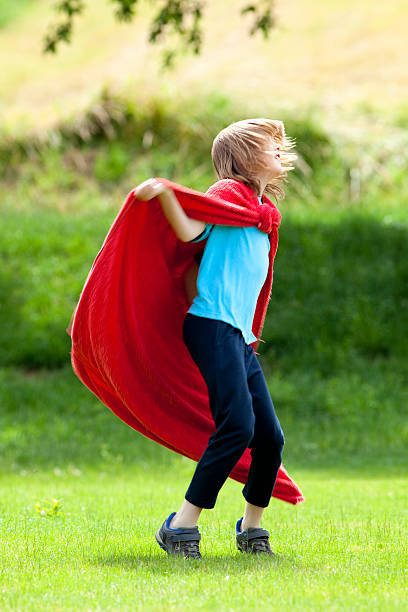 istock Boy Running Around in Red Towel as Superhero Cloak 626011638