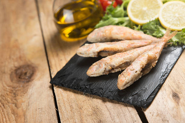 istock Fried red mullet fish served on a plate slate 626036450