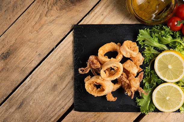 istock fried crispy calamari served on slate plate 626036944