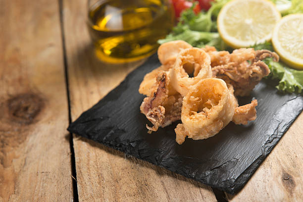istock fried crispy calamari served on slate plate 626037760