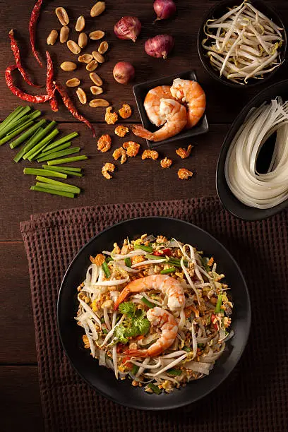 Pad thai, Thai fried noodles on a wood table