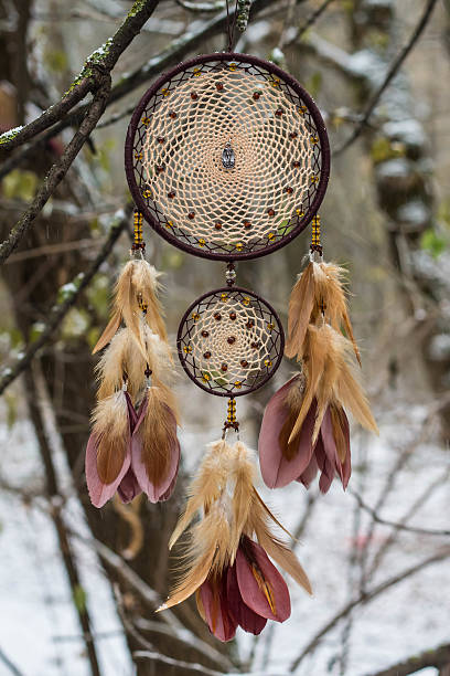 istock Dreamcatcher made of feathers, leather, beads, and ropes 626039914