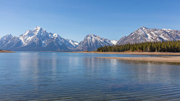 istock Beautiful snow-capped mountains reflected in the lake. 626046194