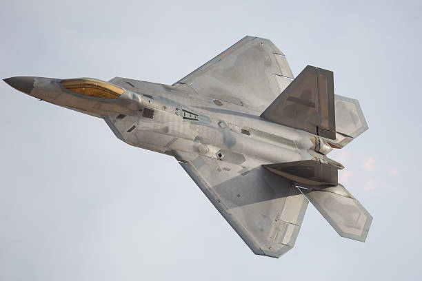istock F-22 Raptor in a turn, with afterburner on 626046340