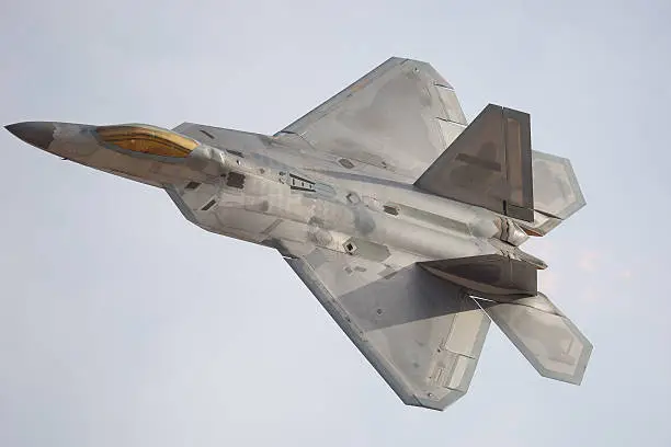 F-22 Raptor in a turn, with afterburner on