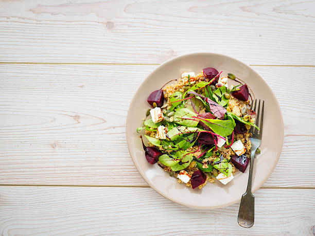 Home made freshness vegetarian food,poached beetroot with quinoa,red chard leaf and marinate feta cheese,pumpkin seeds.