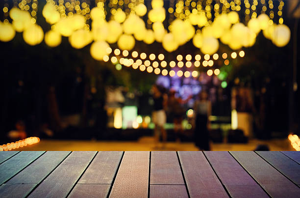 istock image of wooden table in front of abstract blurred background 626055688
