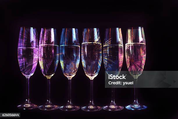 Fireworks Reflected In The Glasses Stock Photo - Download Image Now - Celebration, Celebratory Toast, Purple