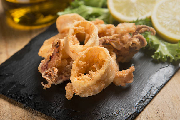 istock fried crispy calamari served on slate plate 626056776