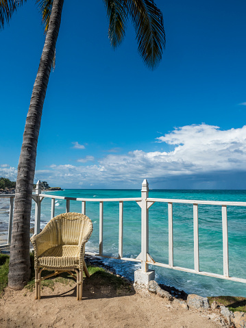 Tropical beach panorama with chair