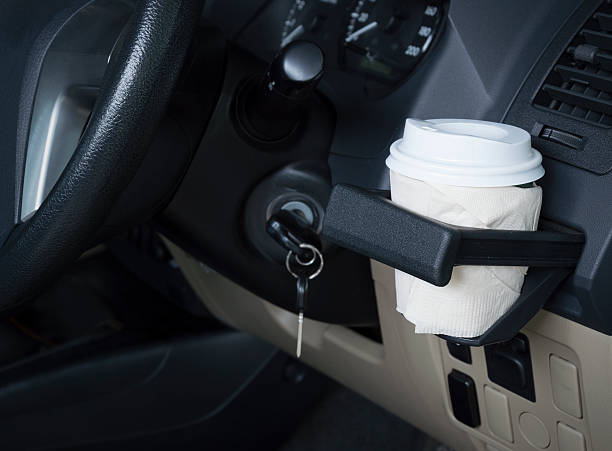 istock Horizontal shot of bottle coffee cup in a car interior. 626058808