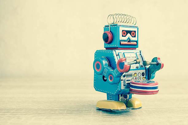 istock Old robot toy on wood table. 626059852