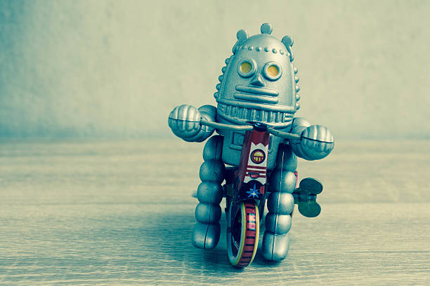 istock Old robot toy on wood table. 626059876