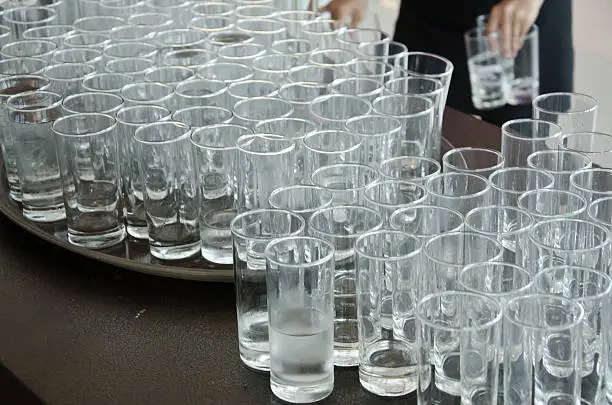 Used cup glass,glass is dirty.dirty glasses want washing.Used cup glass in event.