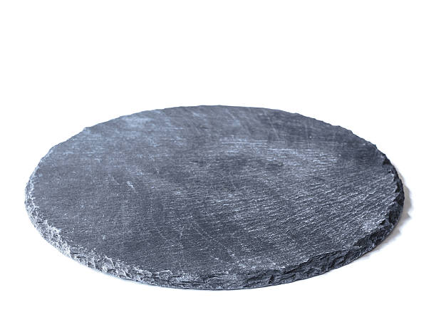 istock Natural black slate dish, isolated on a white background 626067518