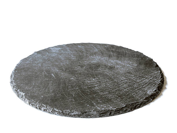 istock Natural black slate dish, isolated on a white background 626067568