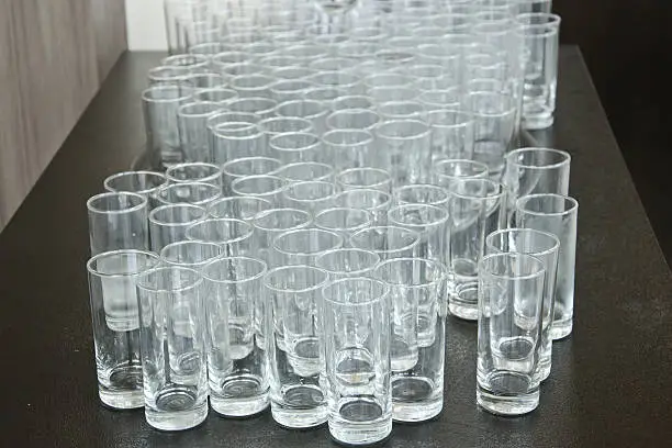 Used cup glass,glass is dirty.dirty glasses want washing.Used cup glass in event.