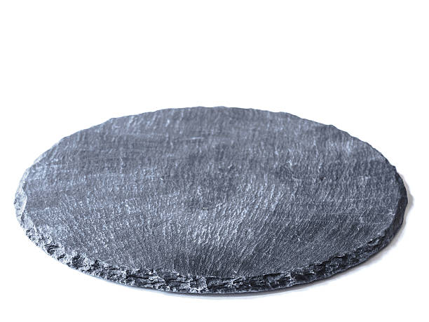 istock Natural black slate dish, isolated on a white background 626067624