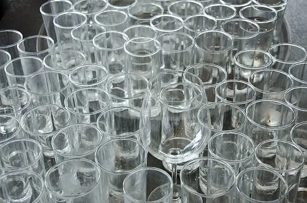Used cup glass,glass is dirty.dirty glasses want washing.Used cup glass in event.