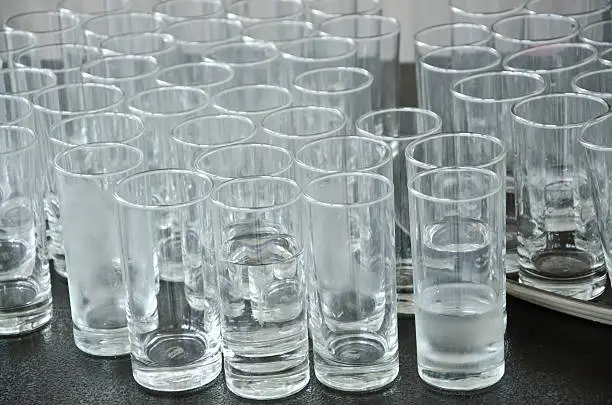 Used cup glass,glass is dirty.dirty glasses want washing.Used cup glass in event.