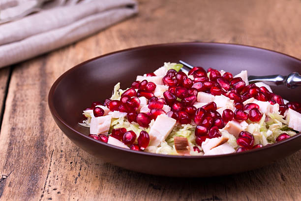 istock Healthy salad with pomegranate seeds, chicken and cabbage. 626068300