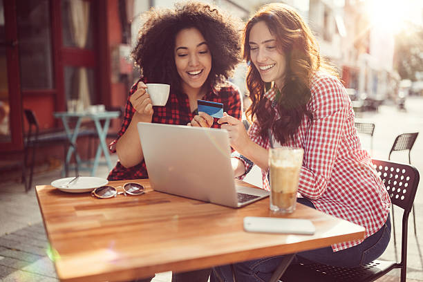 istock Girls drinking coffee and shopping online 626068620