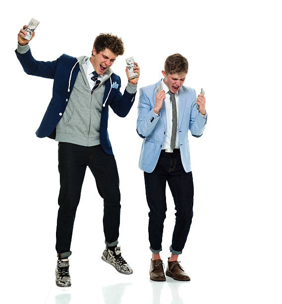 istock Cheerful brothers cheering with money 626069916