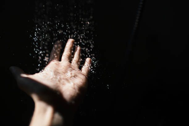 istock Sensual sunny shower at the dark room 626074924