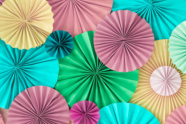 istock Colourful celebration pastel background wall with multicolored paper circles 626075890