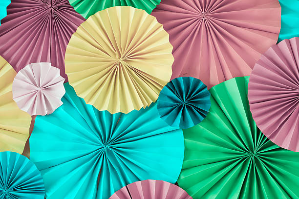 istock Colourful celebration pastel background wall with multicoloured paper circles 626076074