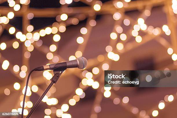 Microphone On Stand With Smooth Soft Warm Light Bokeh Background Stock Photo - Download Image Now