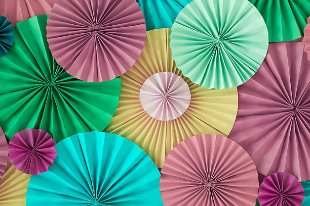 istock Colourful celebration pastel background wall with versicolored paper circles 626077244