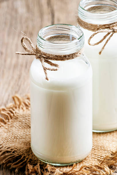 istock Fresh cow milk or cream in glass bottles 626077274