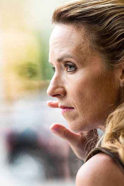 Pensive Mature blond woman