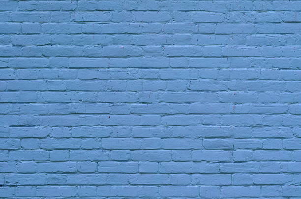 istock Texture of old blue brick wall surface with cement 626079746