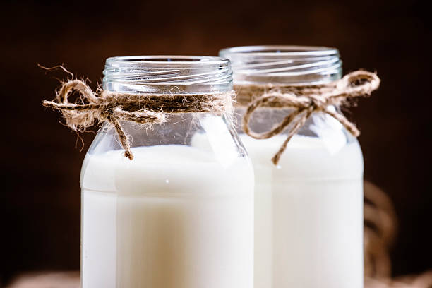 istock Fresh cow milk or cream in glass bottles 626085970