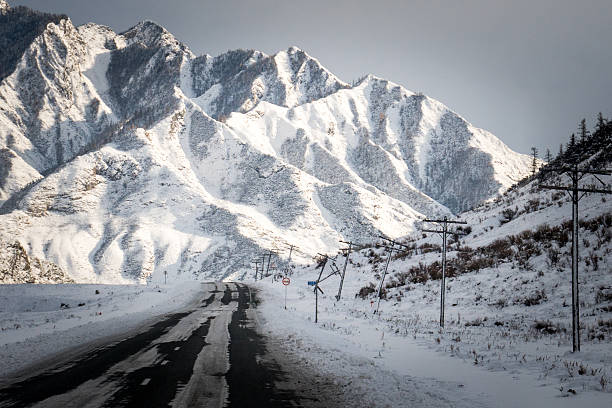 istock Altai Mountains, road, winter 626086836