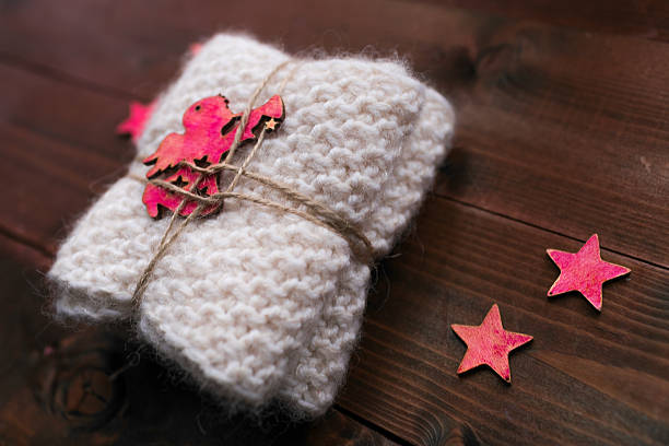 istock Packed scarf-gift from an angel lying on the tree 626086926