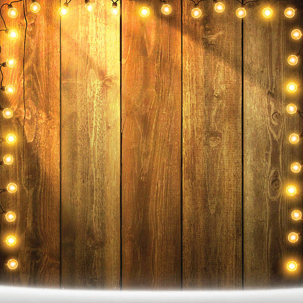 istock Christmas Lights on lit blank wooden background with snow 626087172