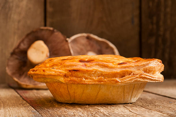 istock Cooked Pie with Mushrooms in the Background 626087352