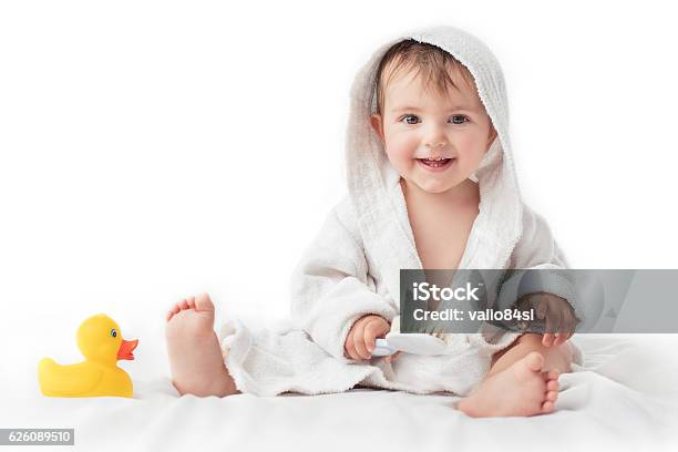 Little Baby Smiling Under A White Towel Bath Time Concept Stock Photo - Download Image Now